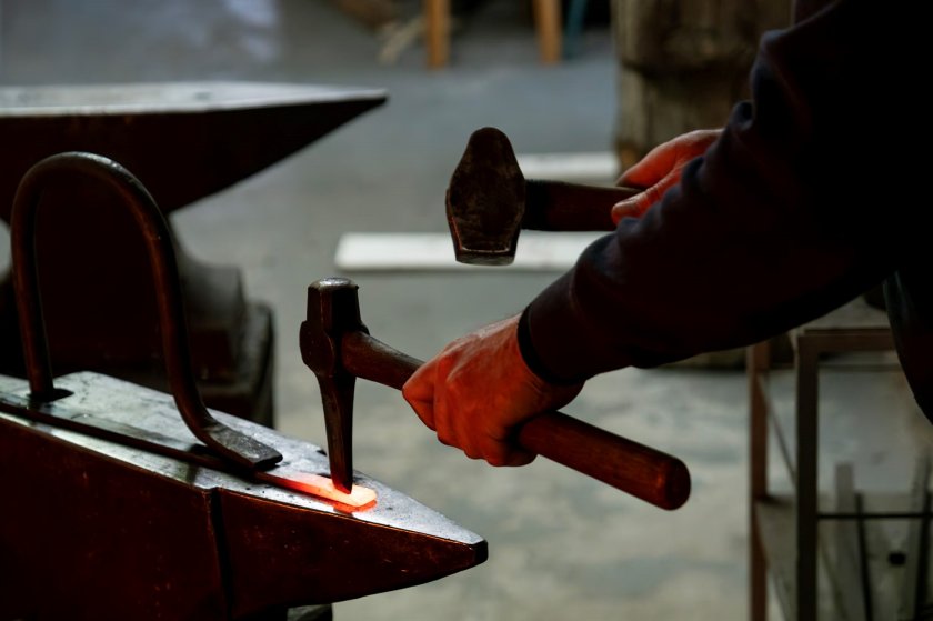 The anvil, a heavy, firmly attached block with a steel surface on which a piece of iron is worked